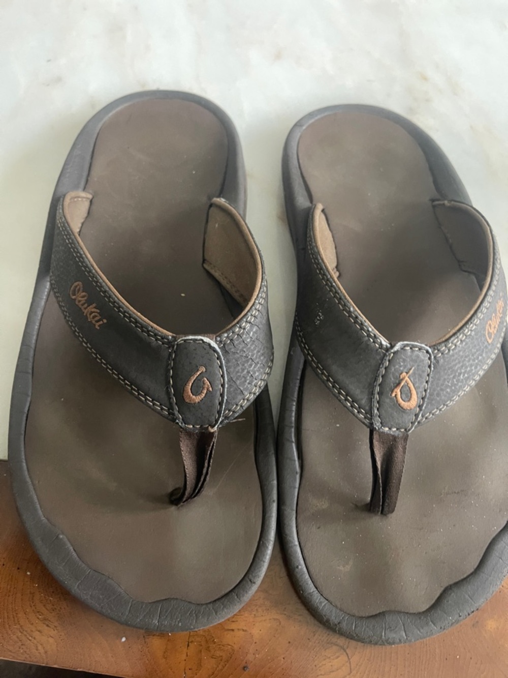 OluKai Dark Brown Leather Thong Sandals with Tan Stitching